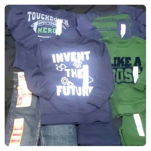 Toddler sweat suits, shirts and a pair of jeans